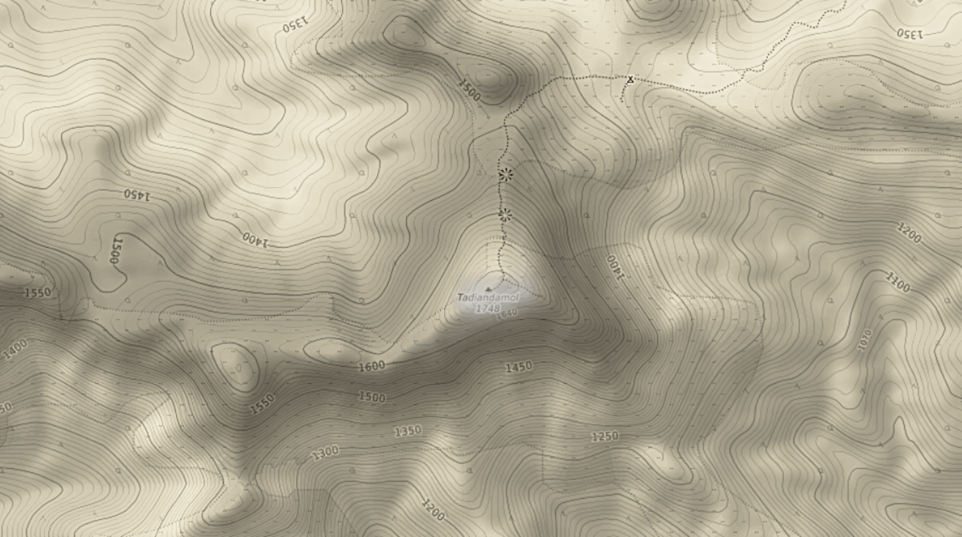 Survey extract of the Tadiandamol massif with 50 metre contours, the summit marked 1748, and a dotted footpath running north off the peak